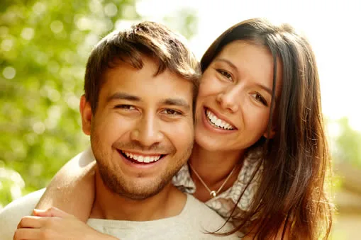 Happy couple smiling after cosmetic dental work